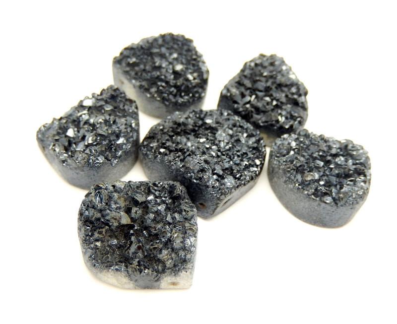 A side view of 6 Teardrop Druzy Beads in Black with a drilled top side to show thickness 