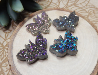 4 Titanium Cabochon Druzy Bumblebee Undrilled Pendants shown at an angle for thickness reference