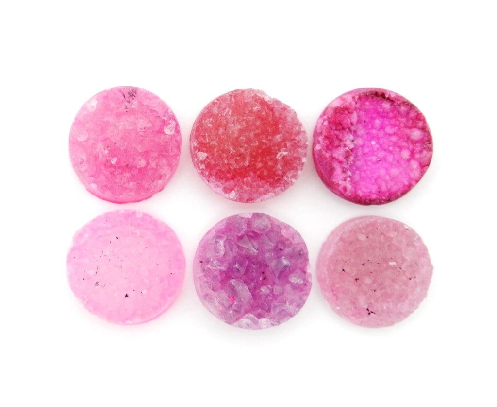 multiple Pink Round Shaped Druzy Cabochons measure 16mm displayed to show various shades of pink and druzy formations
