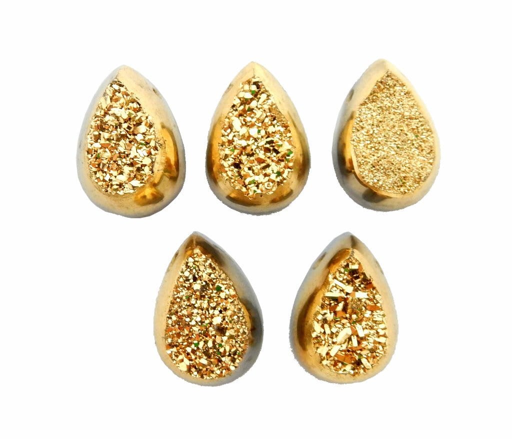 5 gold colored titanium teardrop druzy cabochons on white background