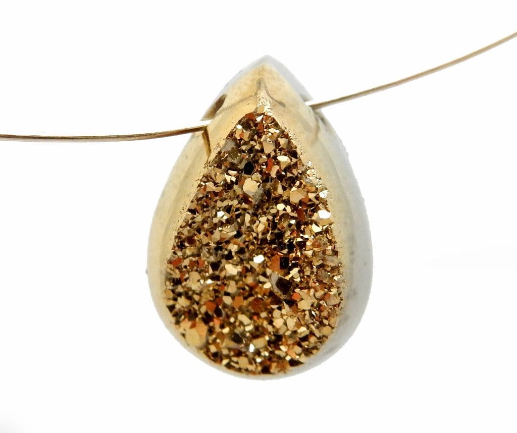 gold colored titanium teardrop druzy cabochon hanging on a gold wire