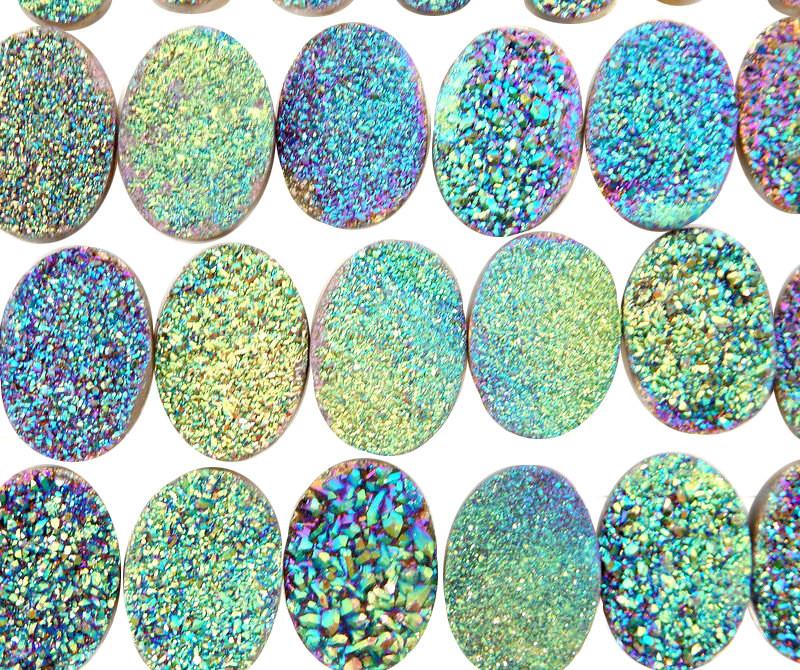 oval druzy cabochons on white background