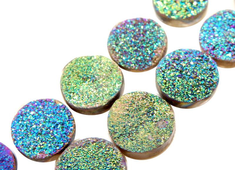 side view of multiple Purple and Green Round Druzy Cabochons for thickness reference