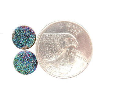 Purple and Green Round Druzy Cabochons next to quarter for size reference