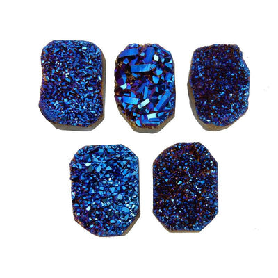 5 blue titanium druzy clusters on white background