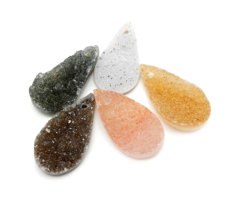 5 druzy drilled teardrop beads on white background