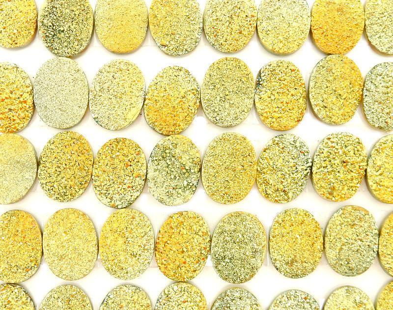 multiple Yellow Oval Shaped Druzy Cabochons displayed to show various shades of yellow texture druzies