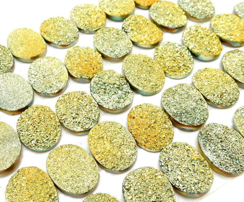 side view of Yellow Oval Shaped Druzy Cabochons for thickness reference
