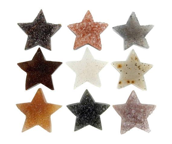 9 druzy star beads on white background