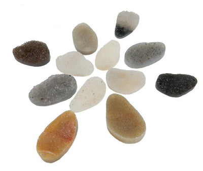 12 assorted druzy cabachons to show they vary in color from white, gray, black, brown, tan, orange, purple.  They have a drill hole on each side.