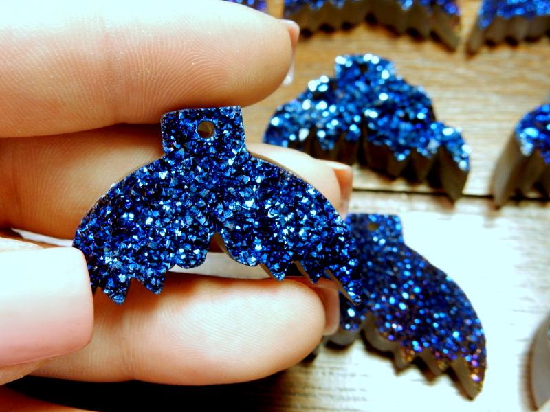 druzy mermaid tails with decorations in the background