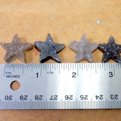 Five Petite Star Druzy Druzy Cabochon Wire Wrapped Jewelry next to a ruler for size comparison