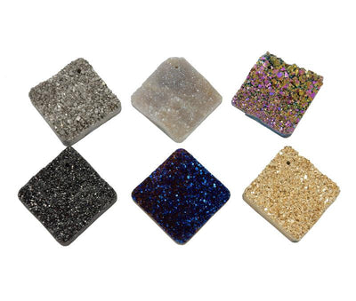 6 various druzy diamond shaped beads on white background