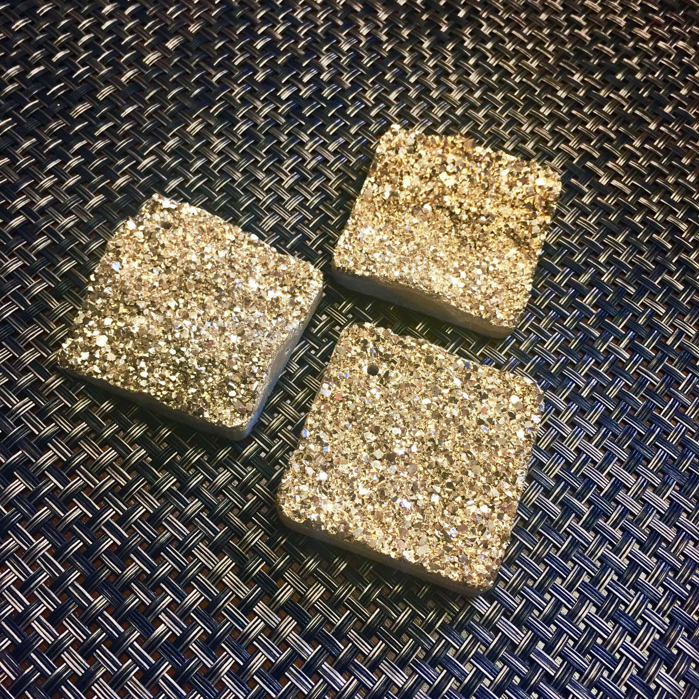 3 druzy diamond shaped beads on dark background