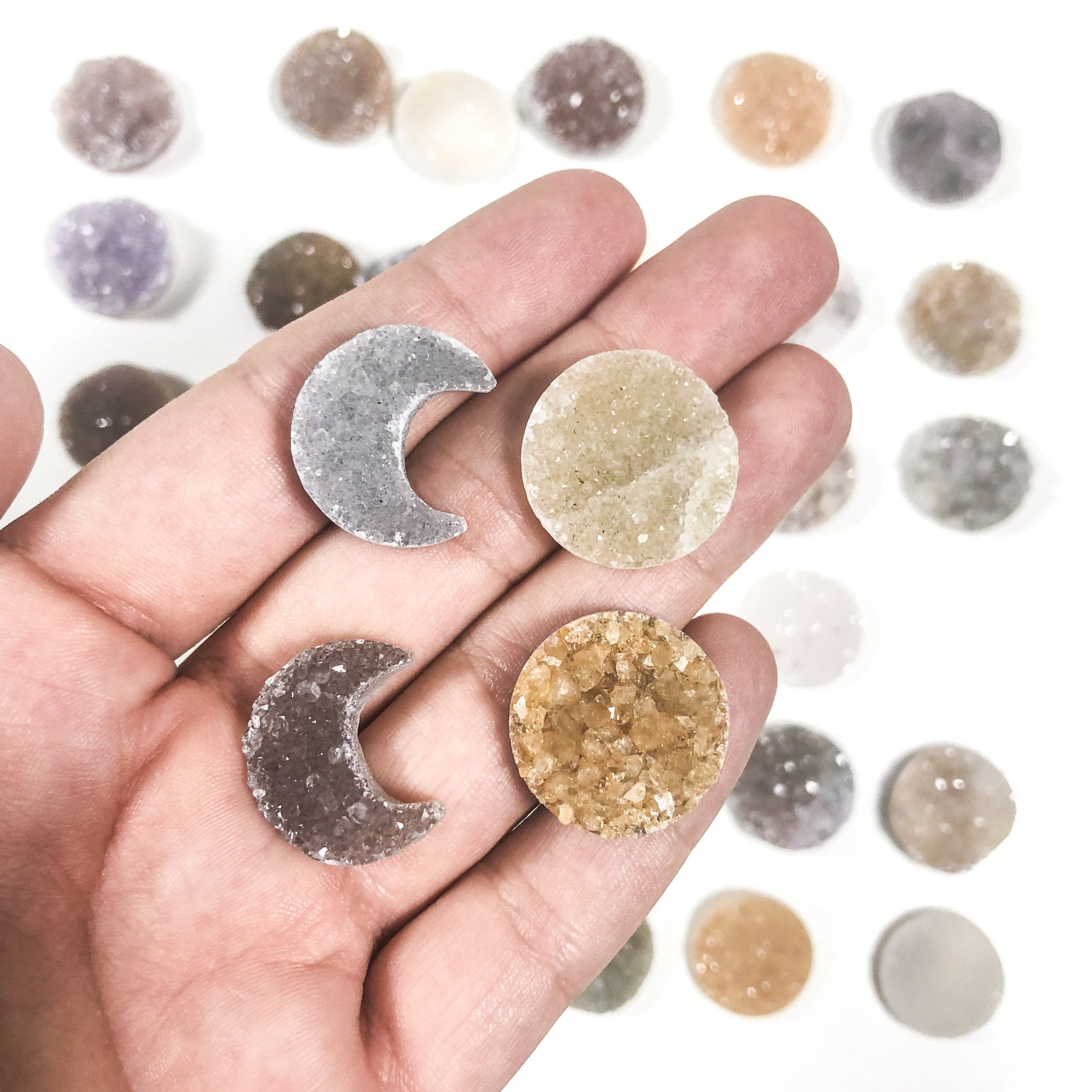 Druzy Moon Crescent and Circle Cabochons in hand for size reference