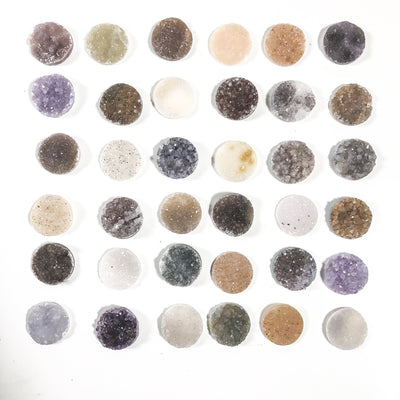 Various Druzy circle cabochons displayed to show various colors and textures