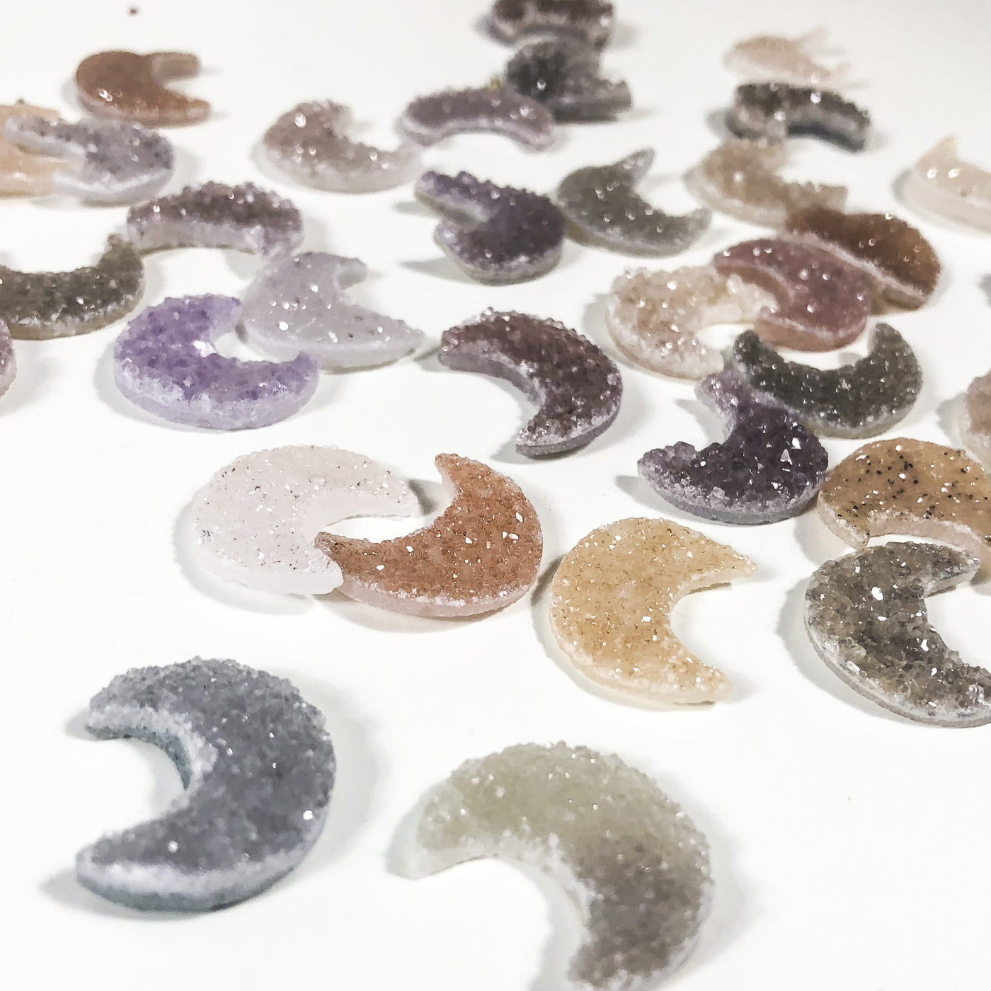 side view of moon crescent cabochons for thickness reference