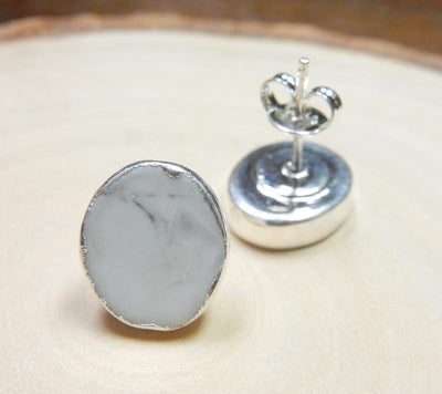 up close shot of howlite oval earrings in silver
