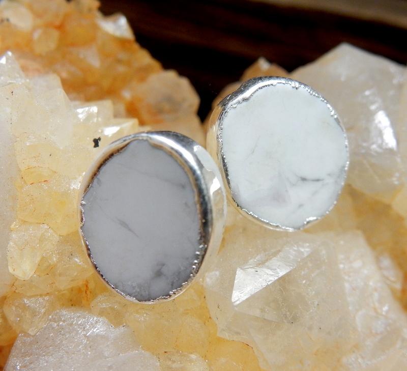 up close shot of howlite oval earrings in silver on crystal
