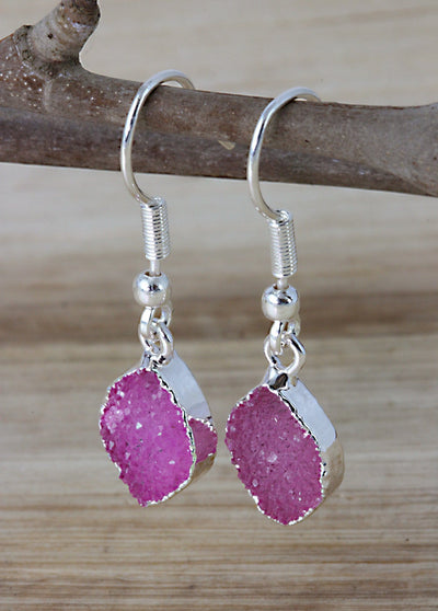 pink marquise earrings on a branch