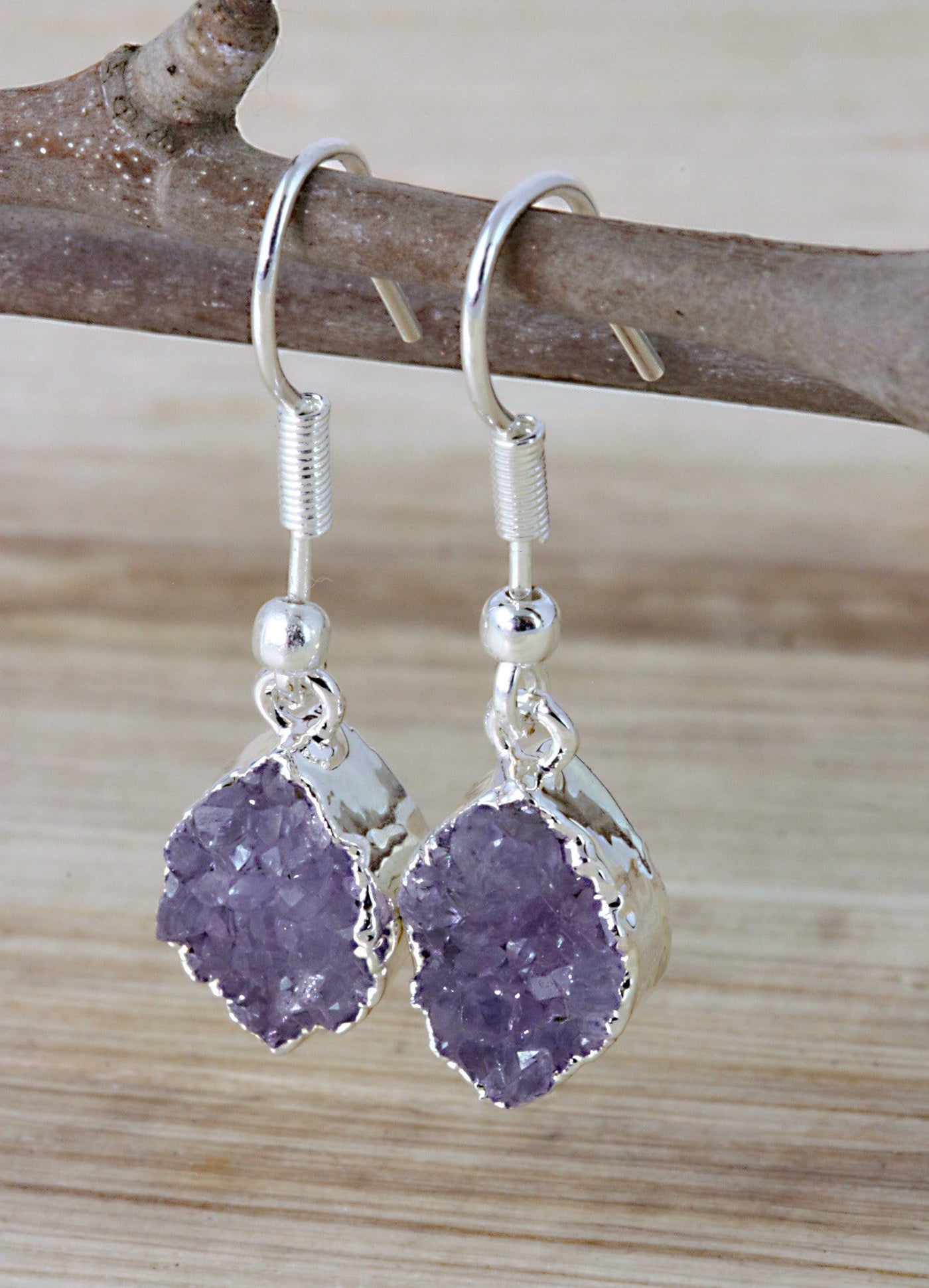 amethyst marquise earrings on a branch