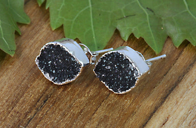 black earrings on a table druzy marquise