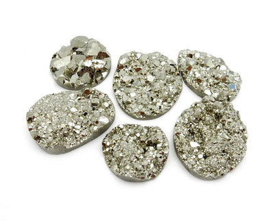6 pieces of Extra Large Pyrite Round Cabochon on white background.