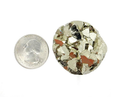 A Extra Large Pyrite Round Cabochon next to a quarter on white background.