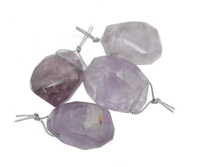 A few of the Amethyst Bead displayed next to each other on white background.