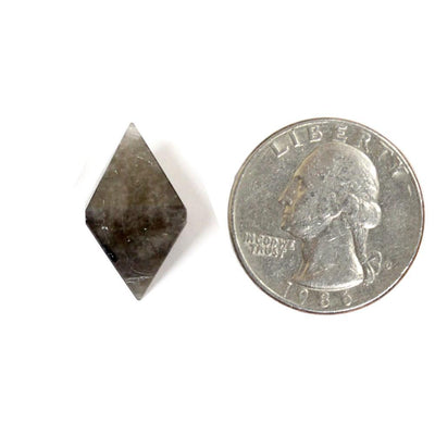 one smokey quartz diamond point with quarter for size reference