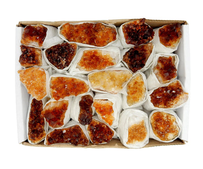 multiple citrine clusters showing the different colors 