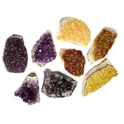Amethyst Clusters and Citrine clusters on a table showing varyimng colors and sizes of stock