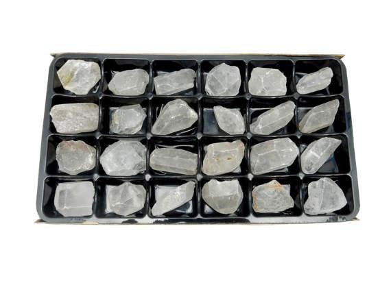 crystal quartz by the box on white background
