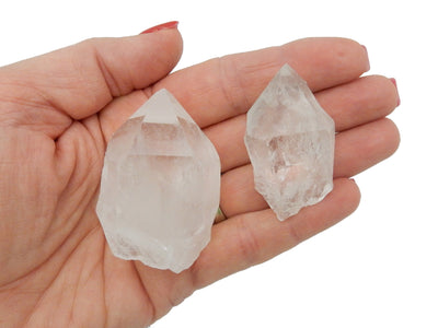 2 Crystal Quartz Points in a hand for size reference