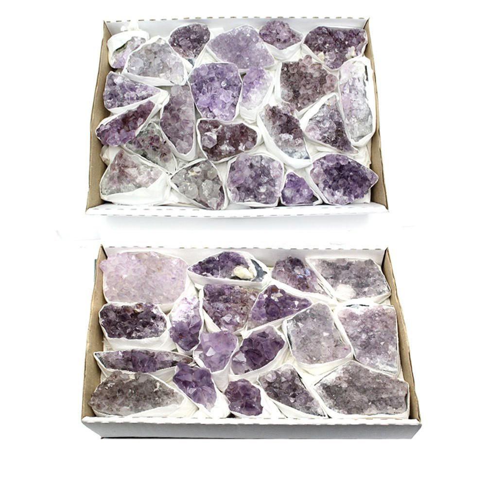 2 open boxes of light amethyst clusters
