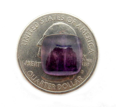 A Tiny Rainbow Fluorite Square Shape on the top of a quarter.