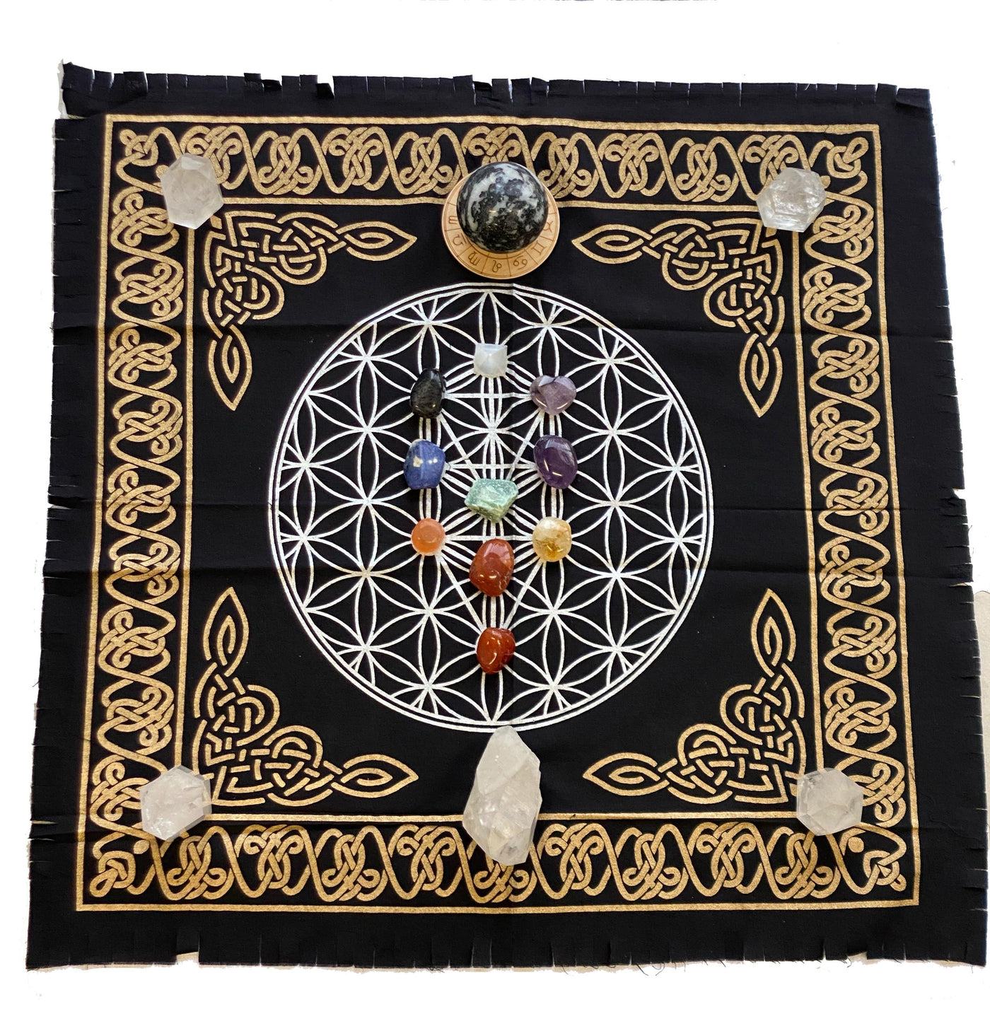 flower of life alter grid.  It is black with a white grid imprinted on it and gold borders and corners.