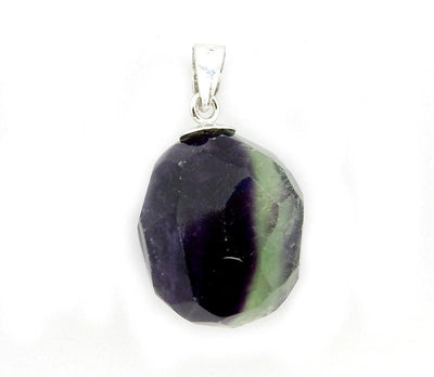 close up of purple and green fluorite pendant to view natural characteristic inclusions