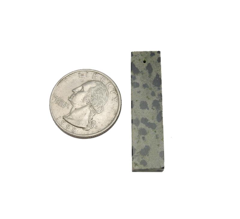 Gemstone Bar Bead displayed next to quarter for size reference