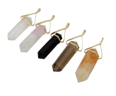 5 various point pendants with gold plated caps on white background