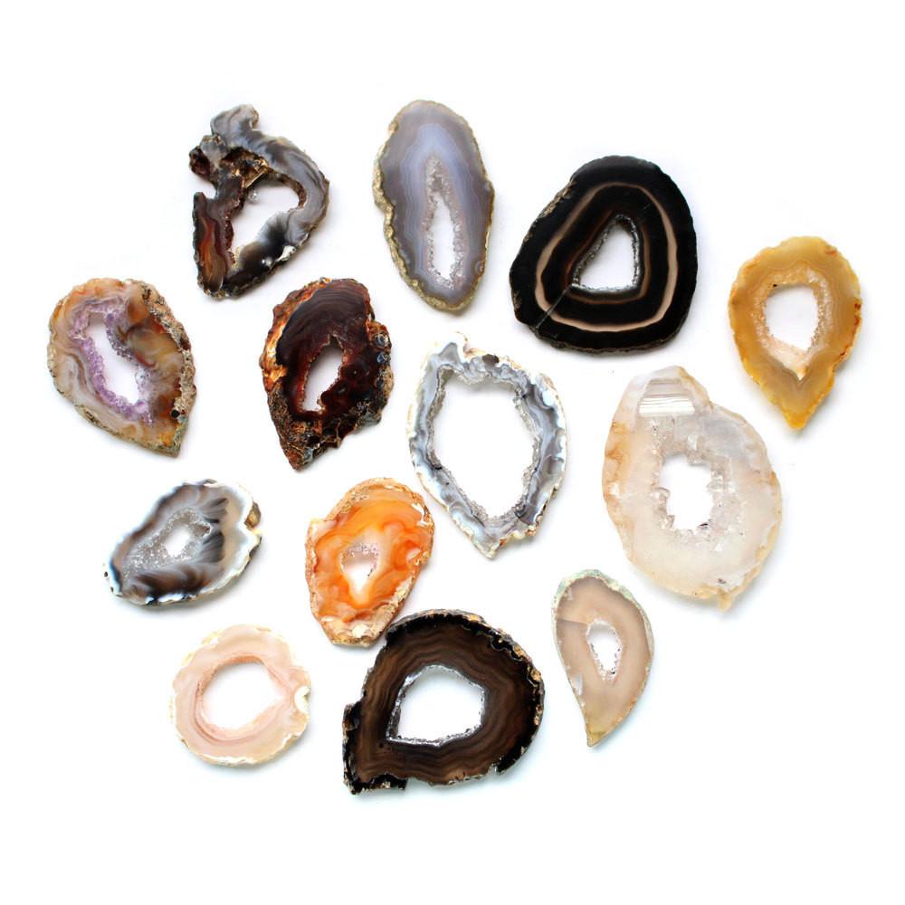 This Picture is showing geode slices being displayed on a white background. 