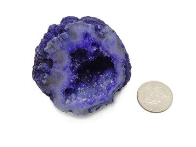 Purple Geode Half next to a quarter for size reference