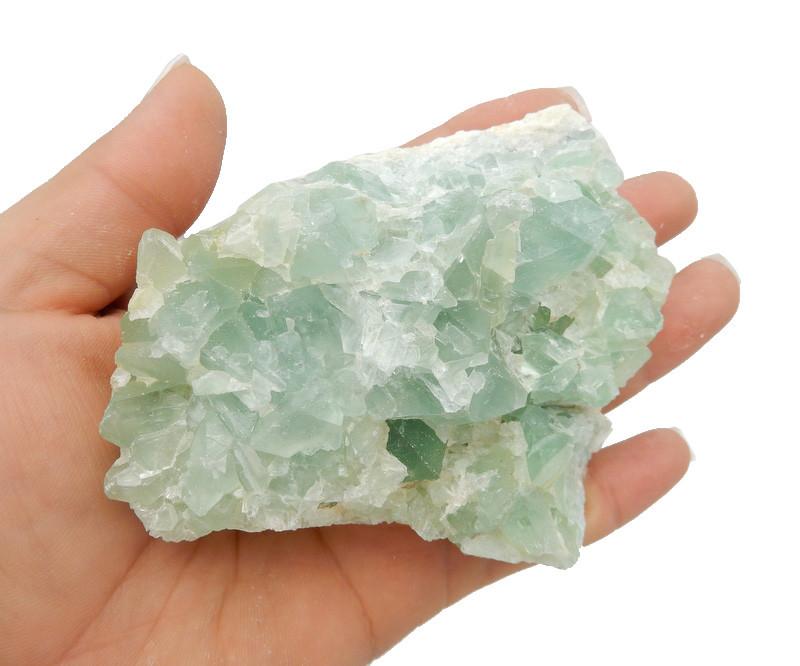 Green Fluorite on hand for size comparison