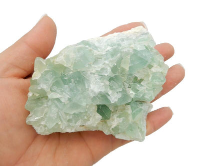 Green Fluorite on hand for size comparison