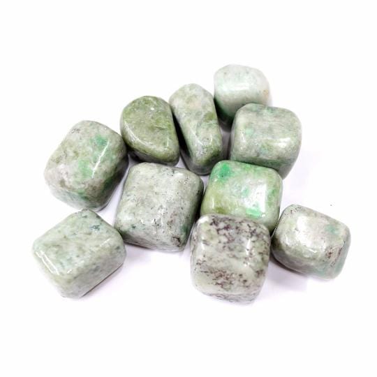 green garnet with decorations in the background