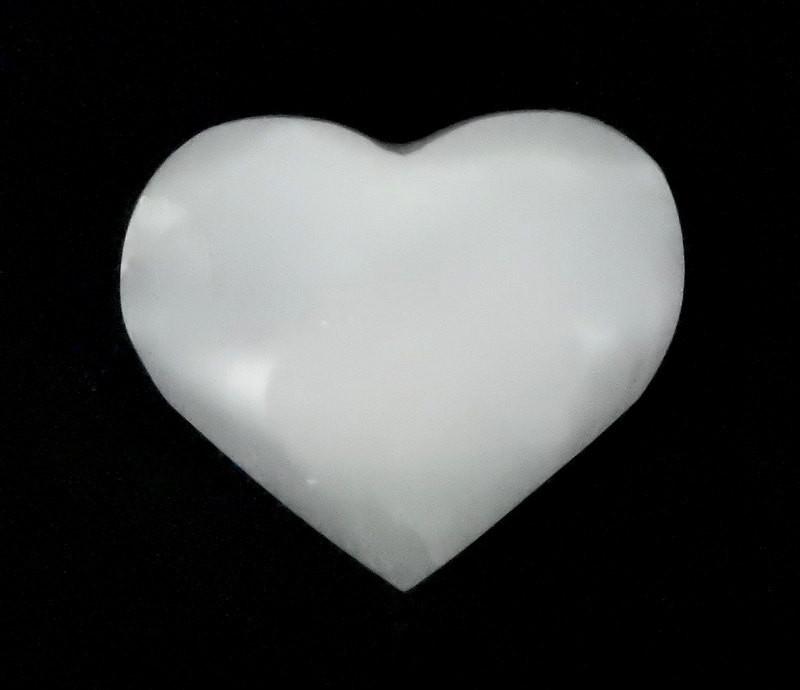 close up of selenite heart stone for details