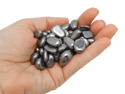 silver hematite in a hand