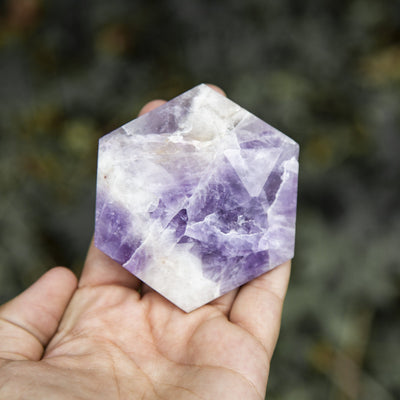 Chevron amethyst hexagon is being held for size reference. 