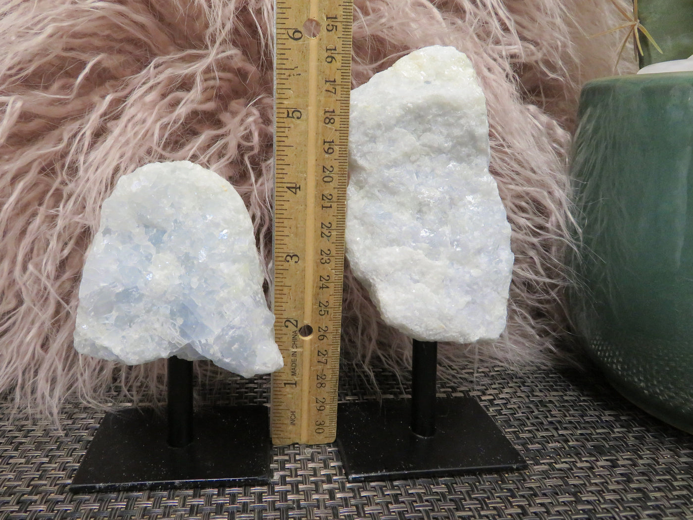 2 blue calcite on stand next to a ruler