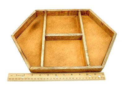wood tray next to a ruler for size reference